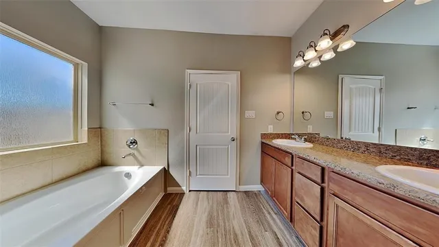 a bathroom with a bathtub and a shower