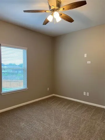 a bathroom with a bathtub and a toilet