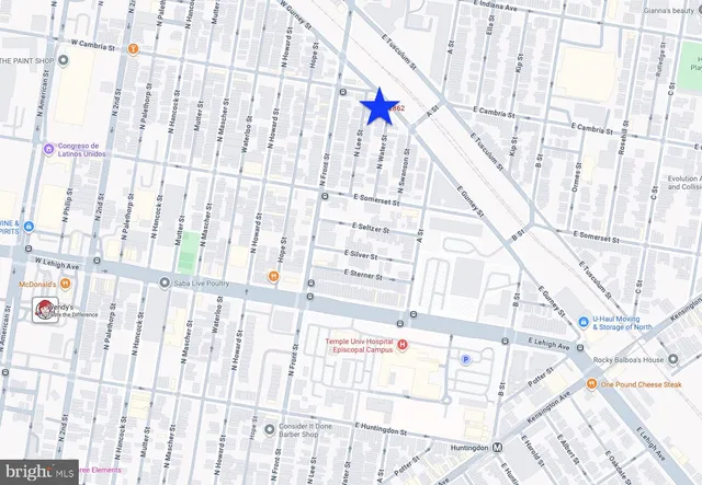 a white bath tub sitting next to a white door