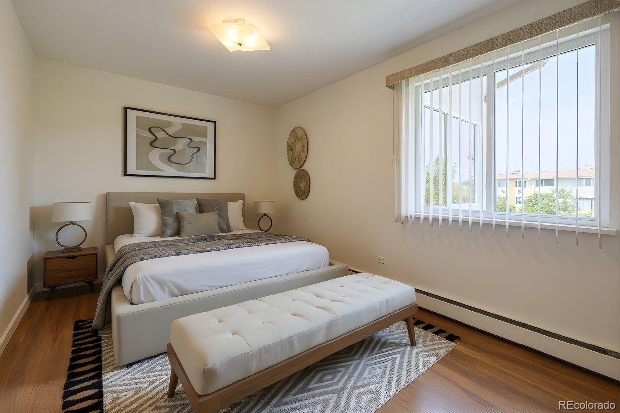 9155 Center Avenue, Unit 2D Denver, CO 80247 - Photo 11 of 50 a bedroom with a bed and a window