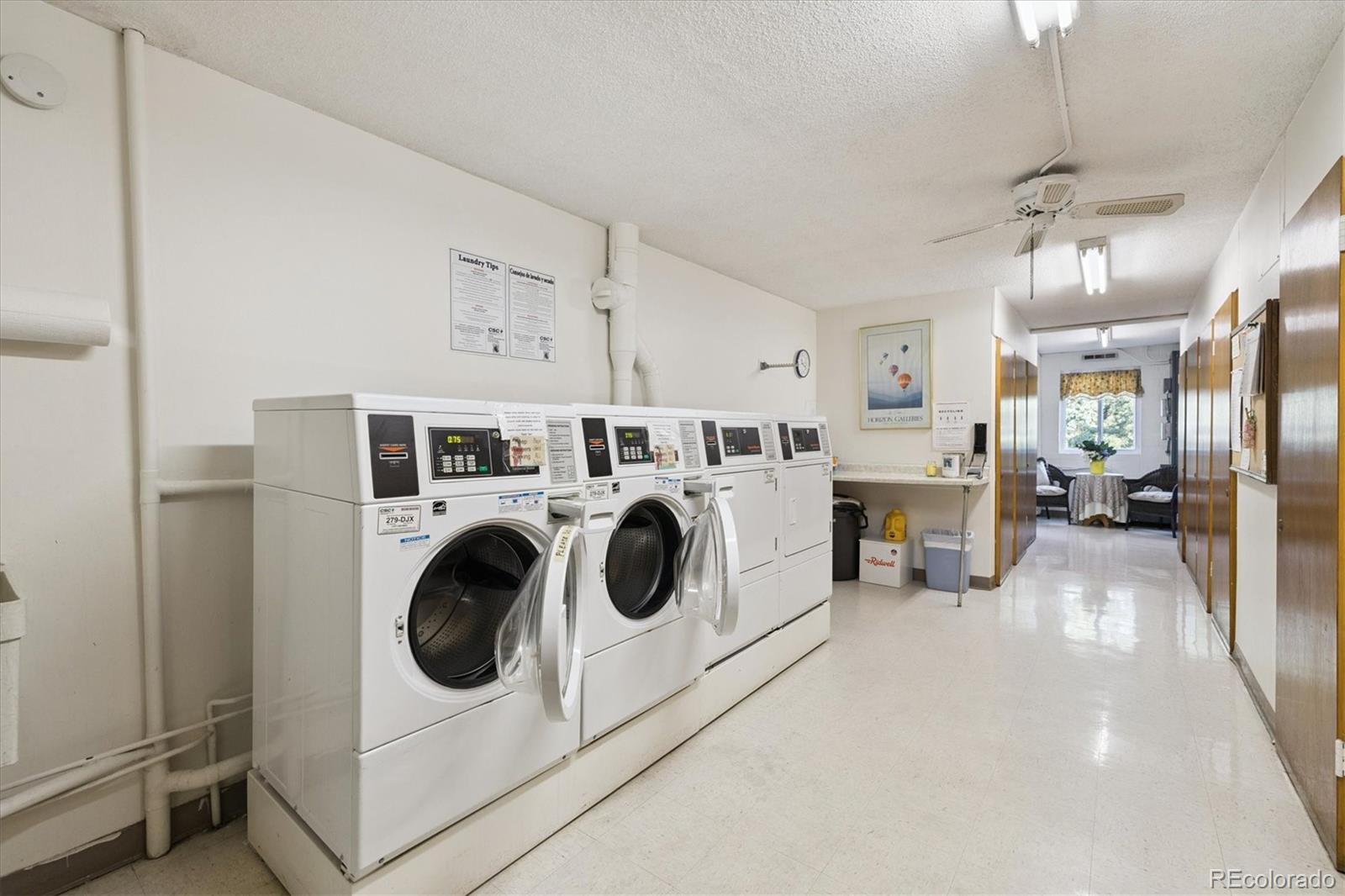 9155 Center Avenue, Unit 2D Denver, CO 80247 - Photo 15 of 50 a utility room with dryer washer and a view of living room