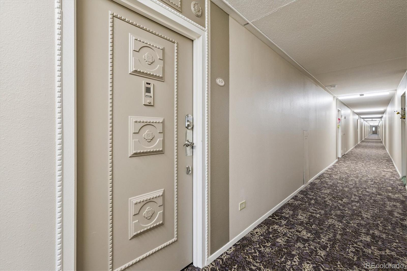 9155 Center Avenue, Unit 2D Denver, CO 80247 - Photo 17 of 50 a view of a hallway with elevator