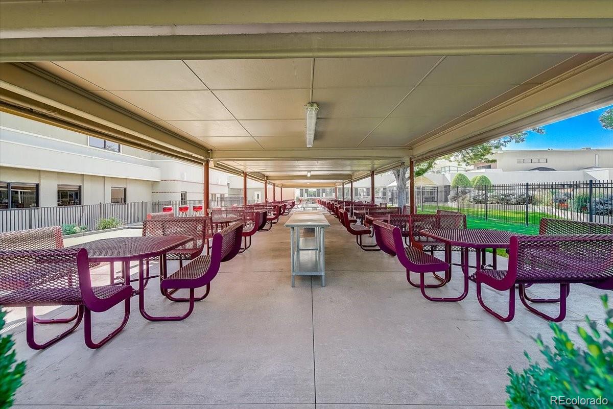 9155 Center Avenue, Unit 2D Denver, CO 80247 - Photo 42 of 50 a view of a chairs and tables in a patio