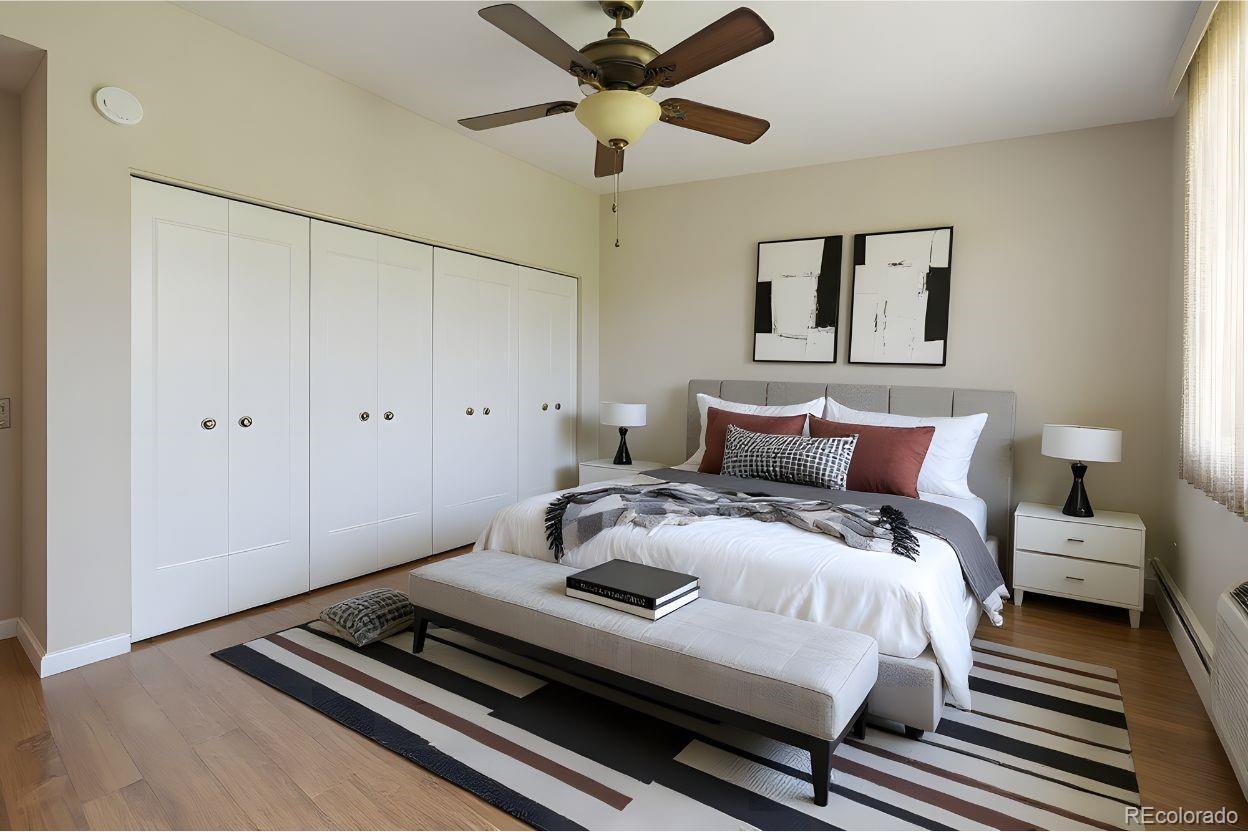 9155 Center Avenue, Unit 2D Denver, CO 80247 - Photo 9 of 50 a bedroom with bed and a ceiling fan