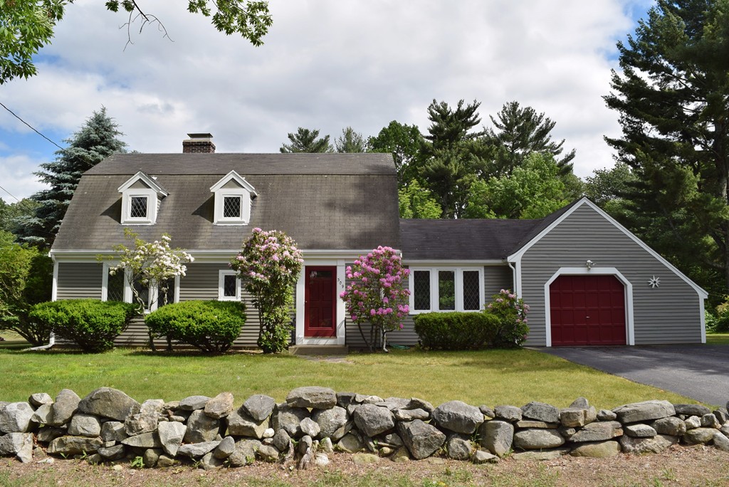 309 Red Acre Road Stow, MA 01775 - Photo 1 of 26 a front view of house with outdoor space and trees around