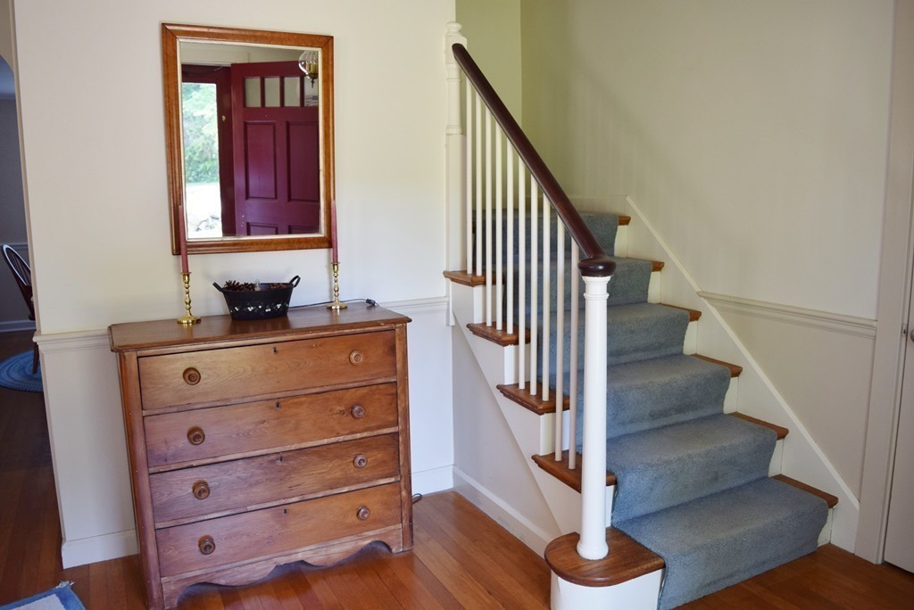 309 Red Acre Road Stow, MA 01775 - Photo 12 of 26 a view of hallway with stairs and wooden floor