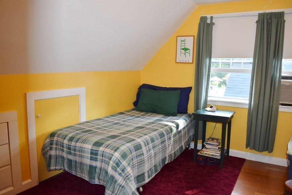 309 Red Acre Road Stow, MA 01775 - Photo 19 of 26 a bedroom with a bed and wooden floor