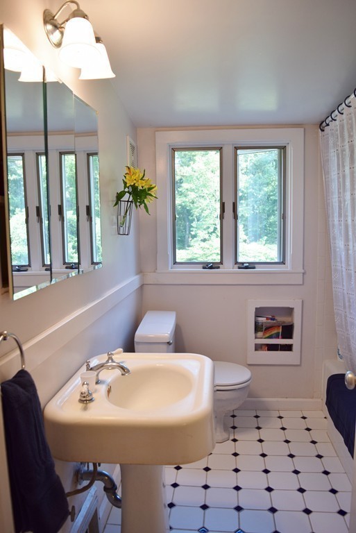309 Red Acre Road Stow, MA 01775 - Photo 20 of 26 a bathroom with a sink a toilet and a mirror