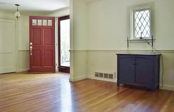 309 Red Acre Road Stow, MA 01775 - Photo 22 of 26 an empty room with wooden floor and cabinet