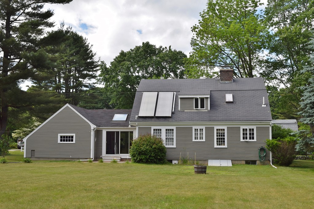 309 Red Acre Road Stow, MA 01775 - Photo 24 of 26 a front view of a house with a yard