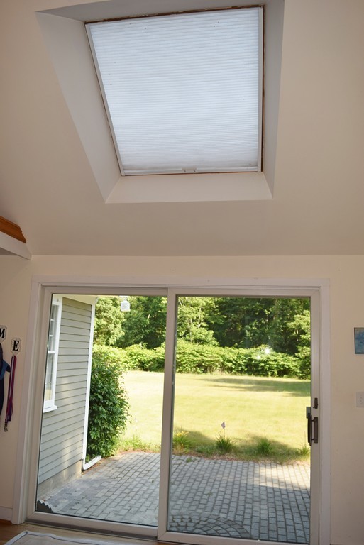 309 Red Acre Road Stow, MA 01775 - Photo 25 of 26 a view of a room that has a large window with kitchen view