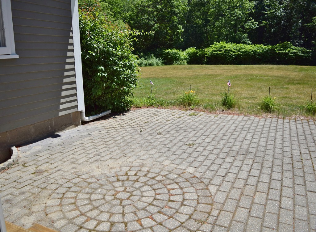 309 Red Acre Road Stow, MA 01775 - Photo 26 of 26 a sidewalk with a white wall