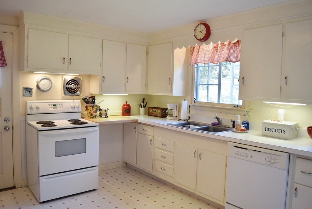 309 Red Acre Road Stow, MA 01775 - Photo 8 of 26 a kitchen with cabinets appliances a sink and a window