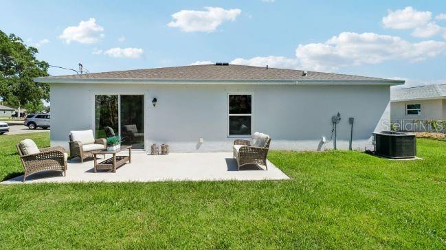 16290 Kakawi Road Weeki Wachee, FL 34614 - Photo 17 of 22 a view of a backyard with table and chairs