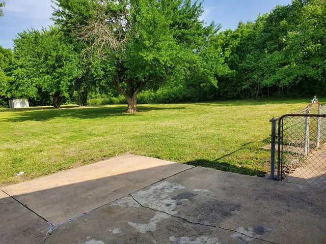 a view of a swimming pool with an outdoor space and seating area