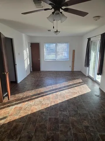 a view of an empty room and a windows