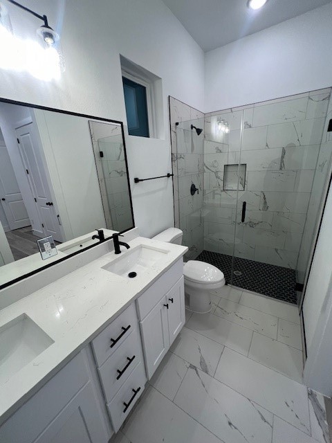 8508 Wileyvale Road, Unit B Houston, TX 77016 - Photo 10 of 16 a bathroom with a double vanity sink mirror and toilet