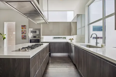 a kitchen with a table and chairs in it