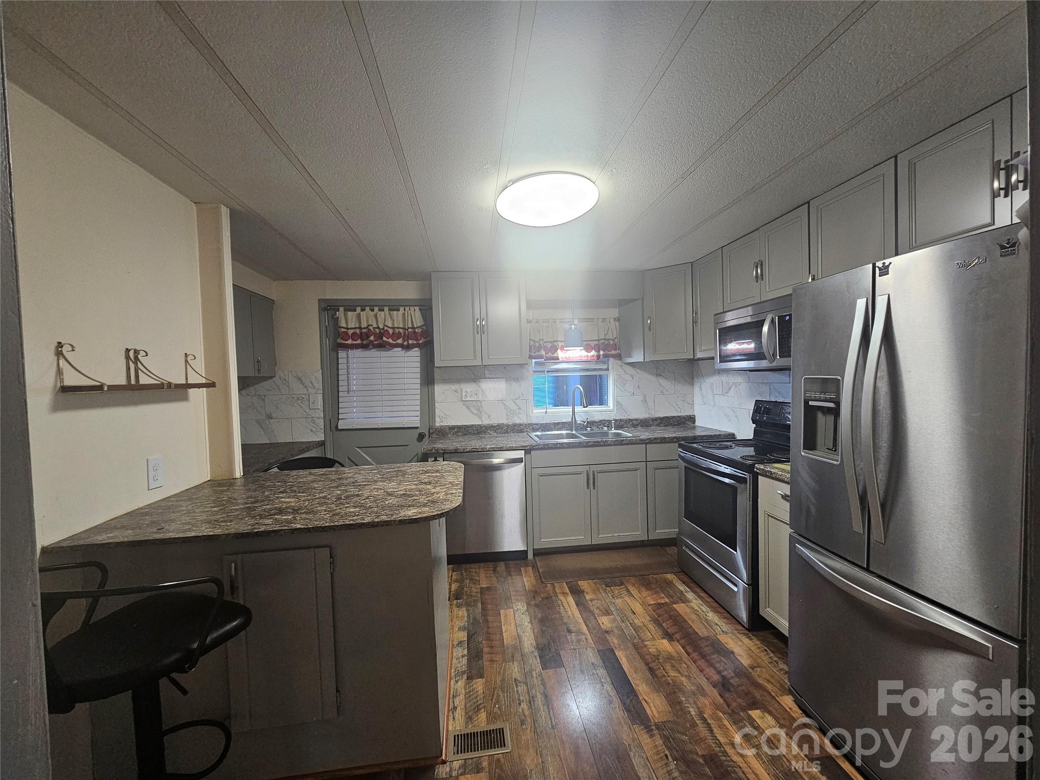 130 Susan Road Casar, NC 28020 - Photo 3 of 14 a kitchen with a sink stove and refrigerator