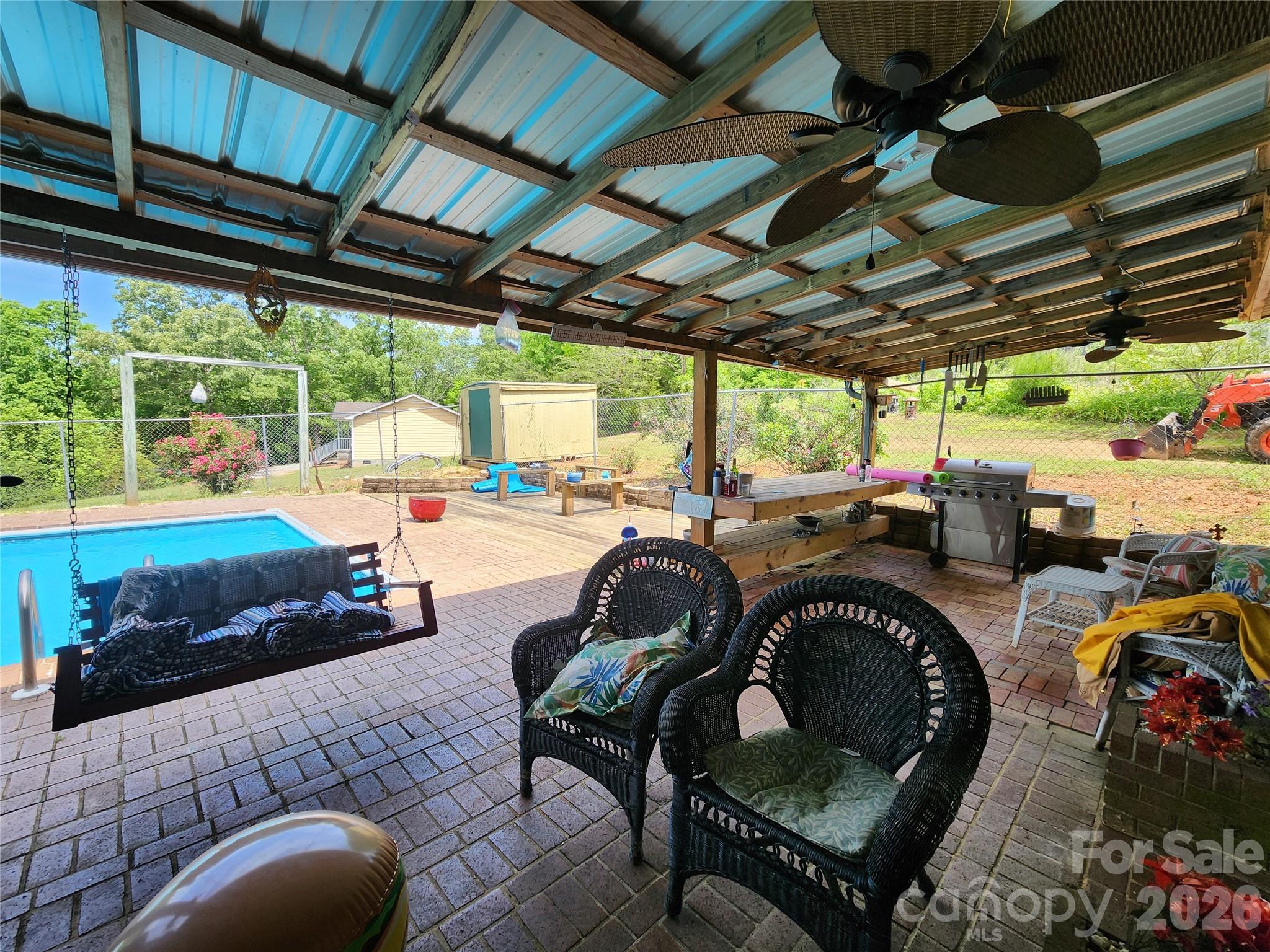 130 Susan Road Casar, NC 28020 - Photo 9 of 14 a roof deck with table and chairs and potted plants