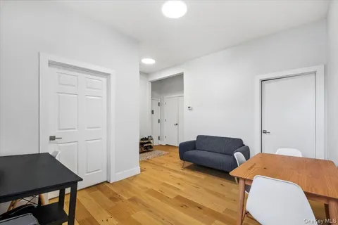 a bedroom with a bed and a chair