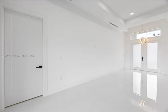 a view of an entryway with wooden floor