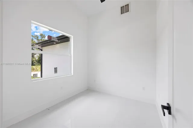 a bathroom with a shower sink vanity and mirror