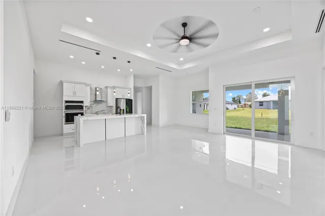 a view of a kitchen with a sink and cabinets