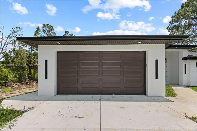 a view of a house with a small yard