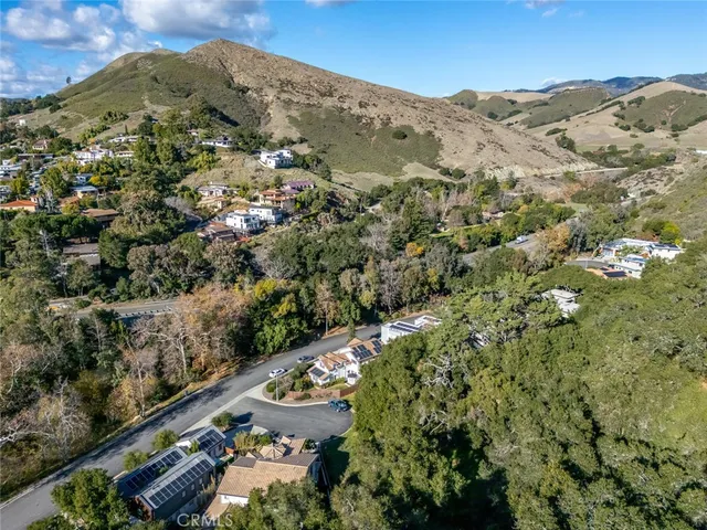 a view of a city with mountains in the background