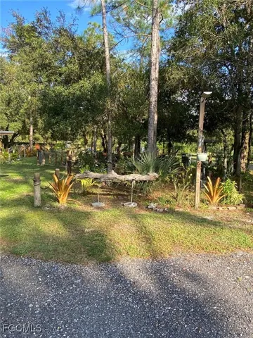 a view of a yard with swimming pool