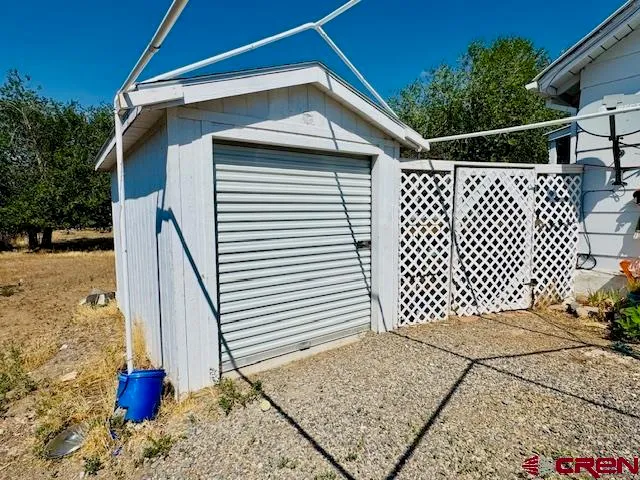a front view of a house with wooden fence