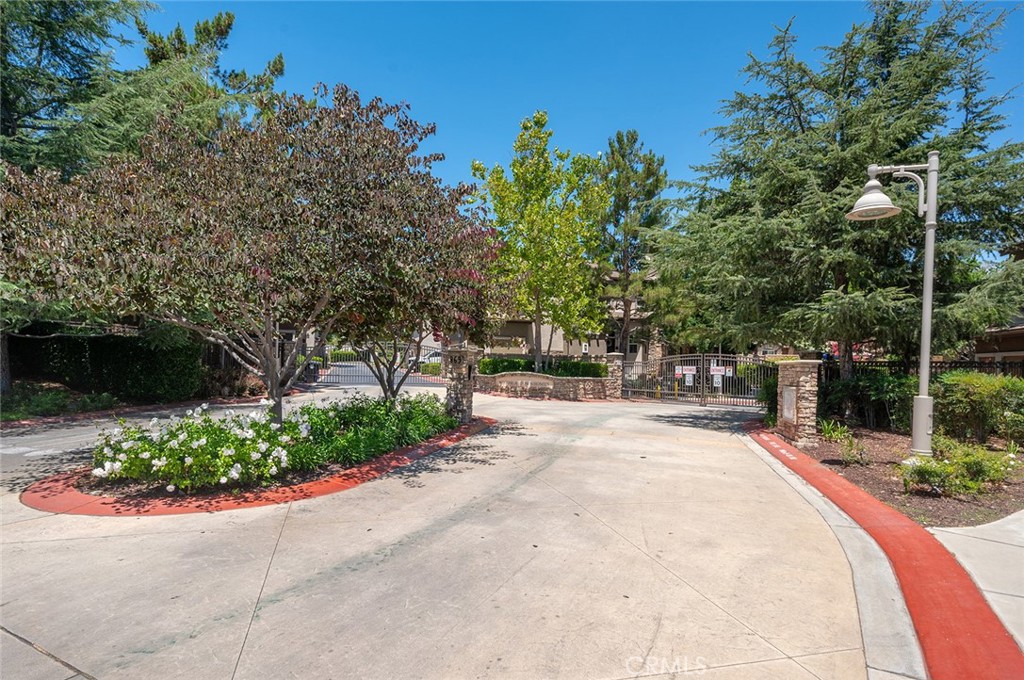 8692 East 9th Street, Unit 37 Rancho Cucamonga, CA 91730 - Photo 1 of 1 a swimming pool with outdoor seating and garden