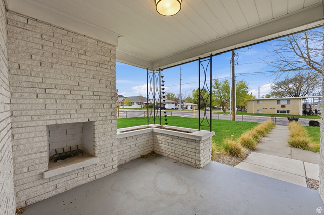 1795 South 200 West Bountiful, UT 84010 - Photo 33 of 37 Covered porch with a residential view and a lawn