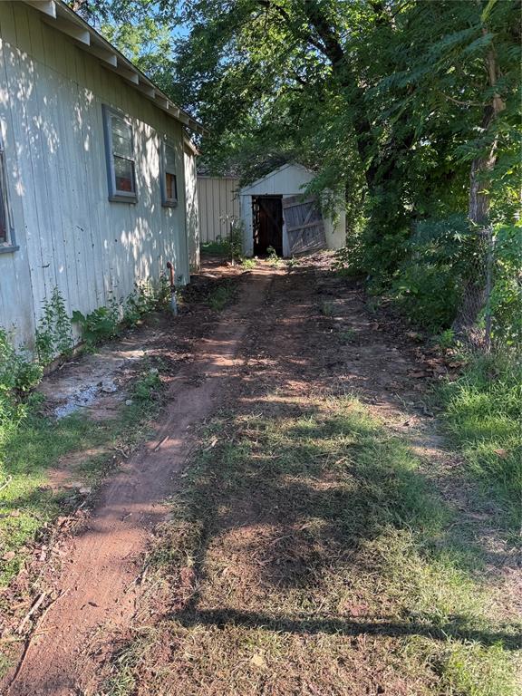 705 North Broadway Street, Unit R Wichita Falls, TX 76306 - Photo 9 of 15 a view of a house with backyard and trees