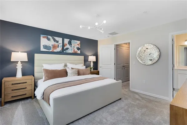 a bedroom with a bed and a dresser