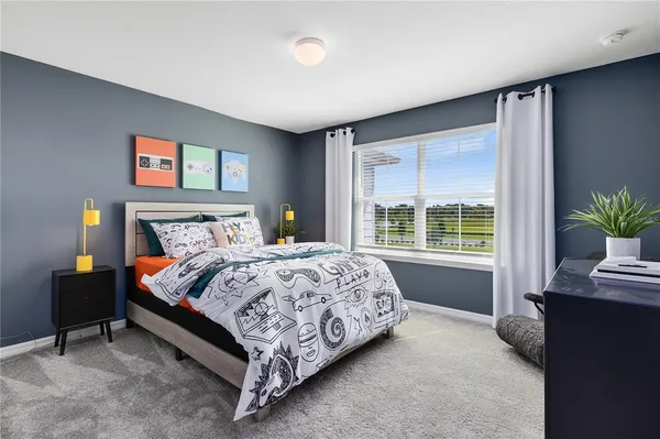 a bedroom with a bed and lamp