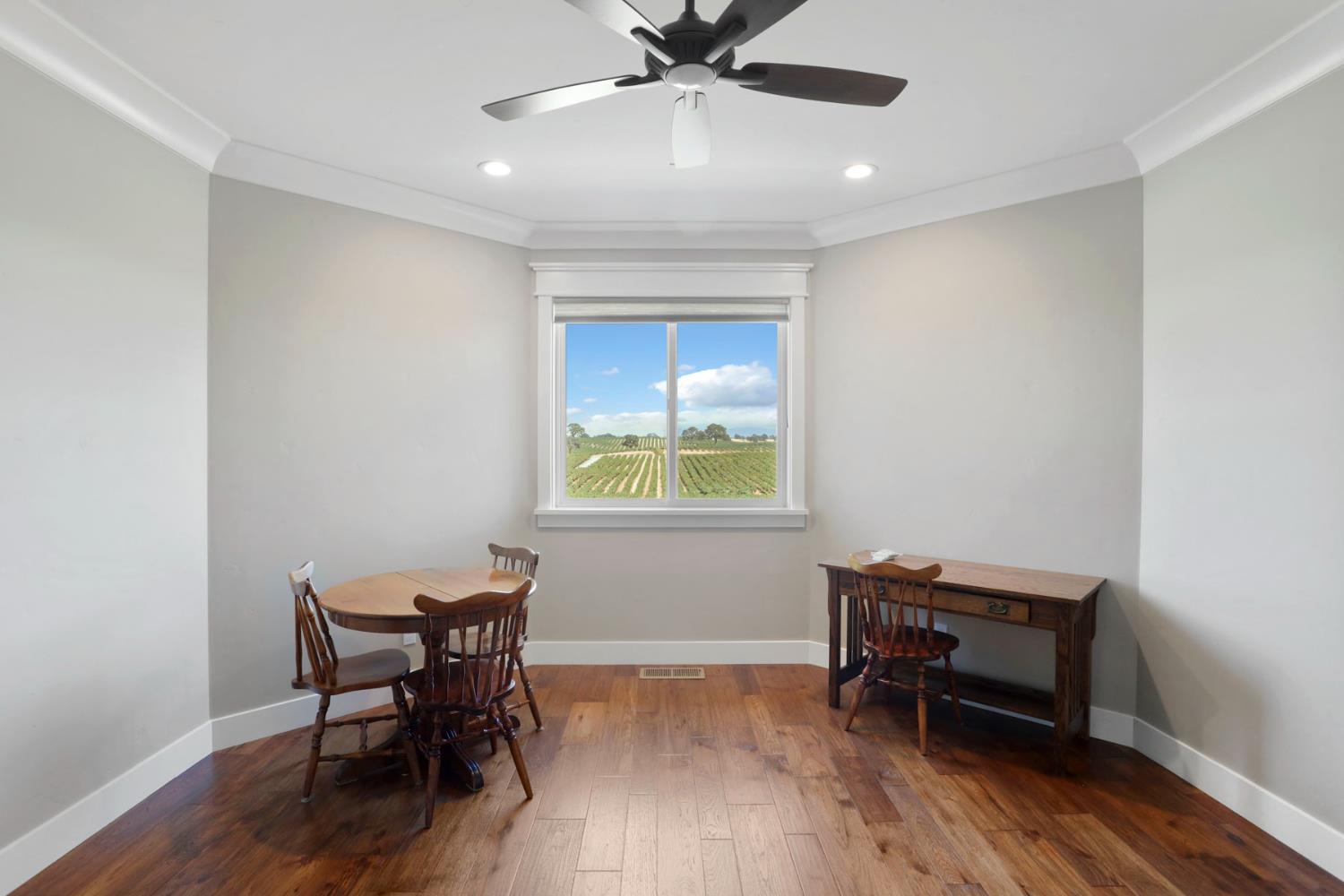 18739 Clements Road Lodi, CA 95240 - Photo 20 of 39 a workspace with wooden floor and a window
