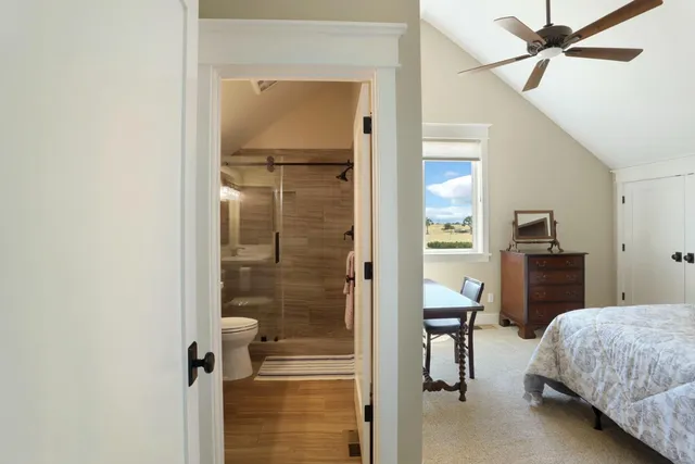 a bedroom with a bed and a desk