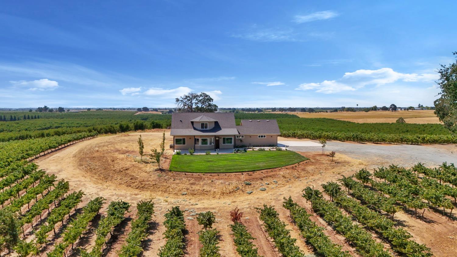 18739 Clements Road Lodi, CA 95240 - Photo 7 of 39 a view of a garden with a building in the background