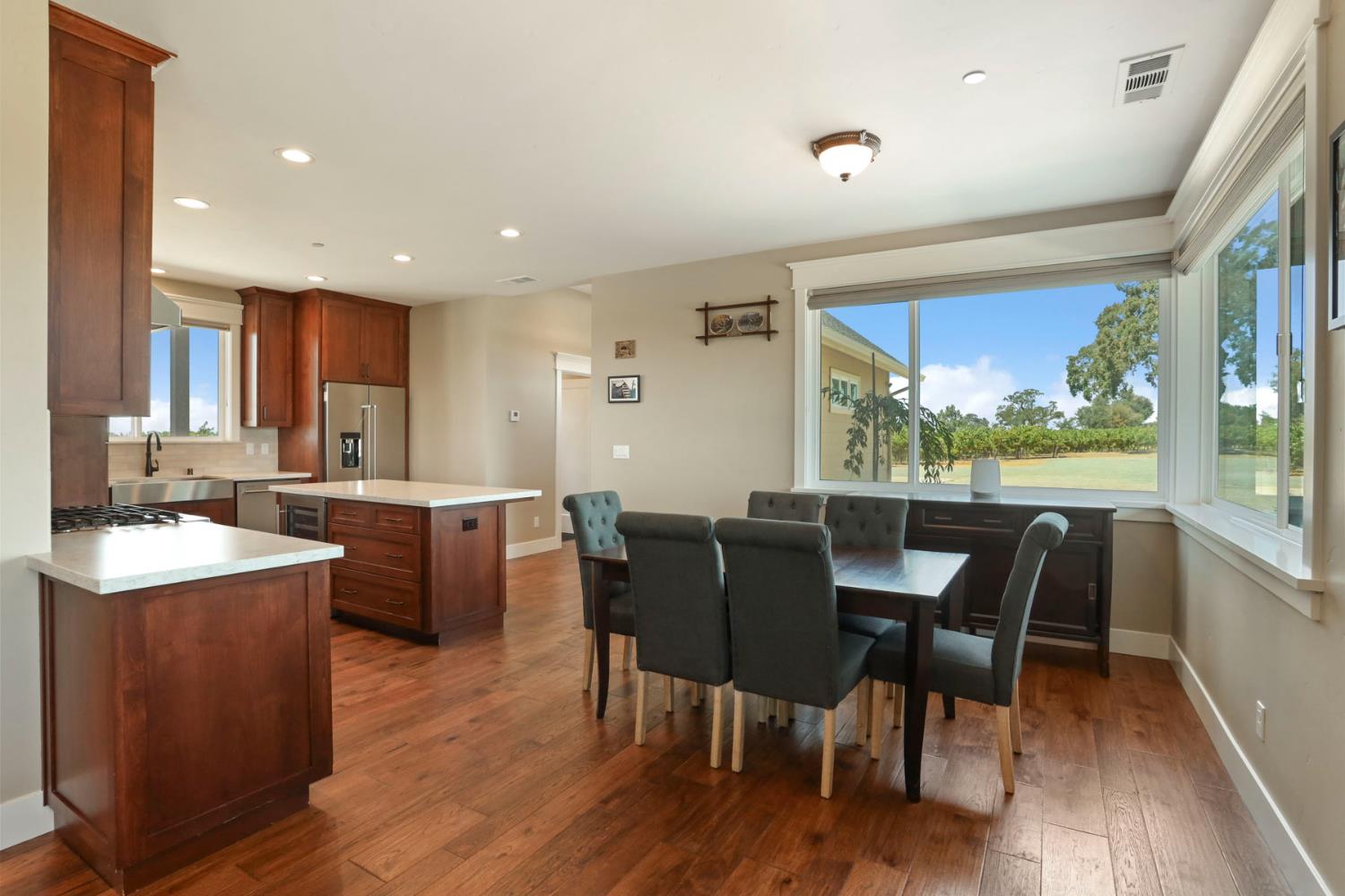 18739 Clements Road Lodi, CA 95240 - Photo 9 of 39 a view of a dining room with furniture window and wooden floor