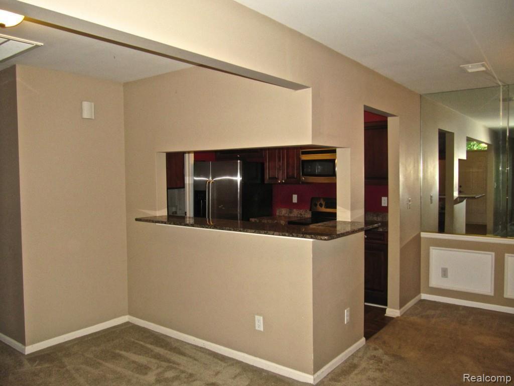 3397 Tremonte Circle, Unit 202 Rochester, MI 48306 - Photo 19 of 35 Dining to Kitchen