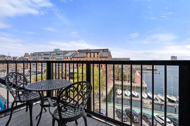 a view of a balcony with chairs
