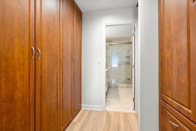 a bathroom with a glass shower door