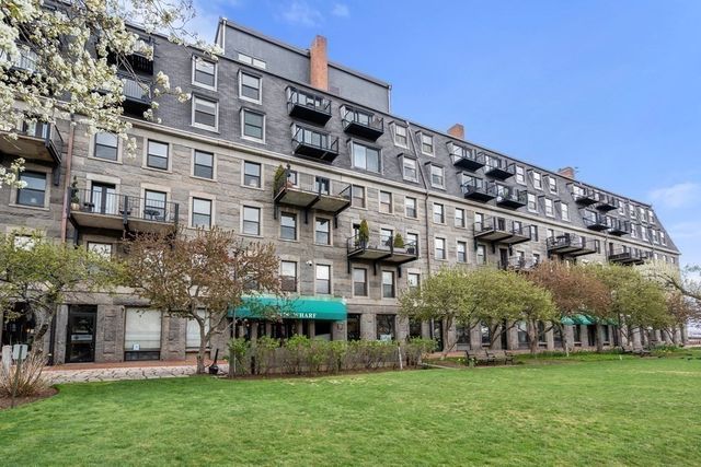 a view of a building with a yard