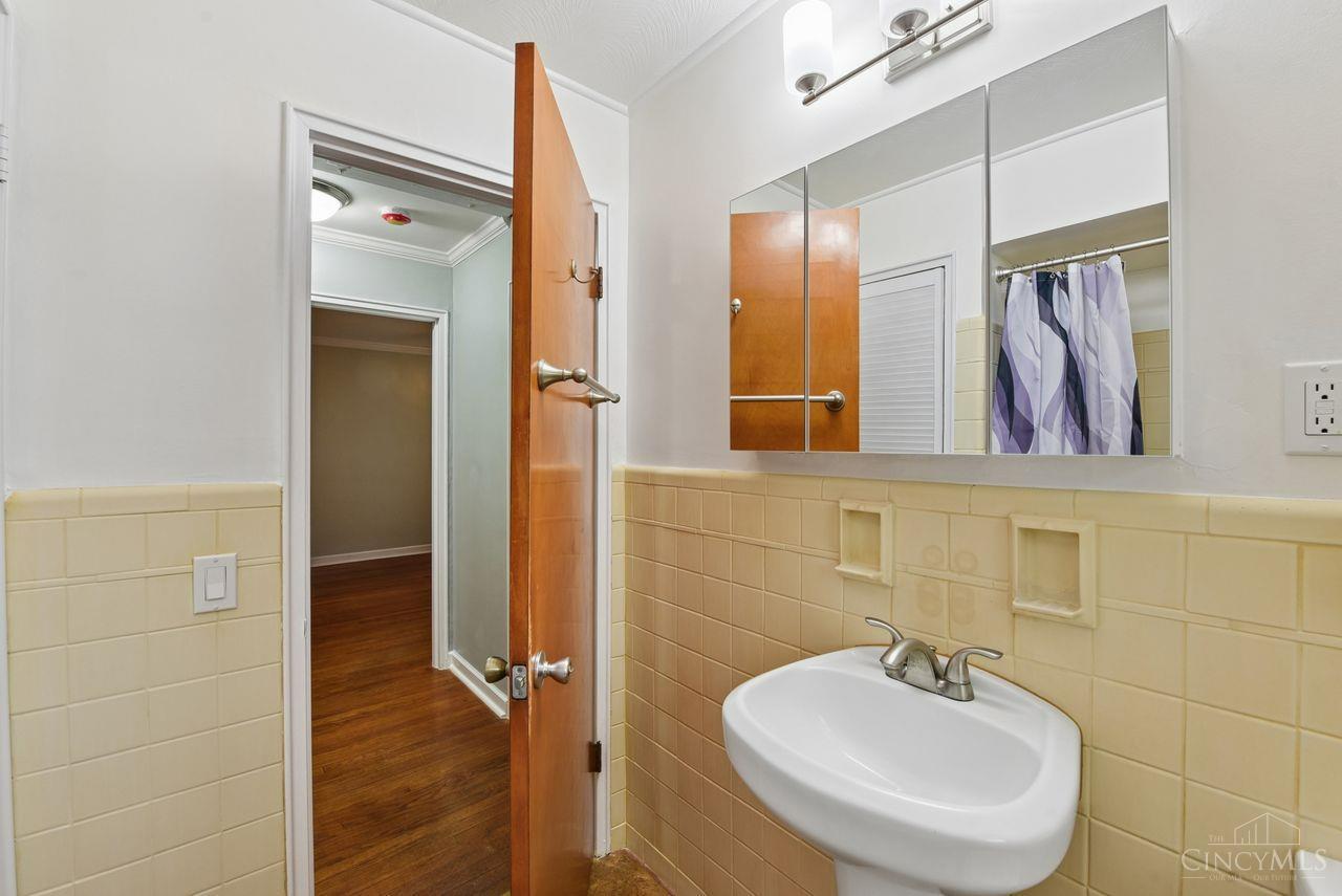 5258 Shepherd Road Cincinnati, OH 45223 - Photo 28 of 43 Here is another view of the Full Bathroom showing the Pedestal Sink, Built in Ceramic Soap Holders, The wide Mirrored Medicine Cabinet and the attractive 3-Light Bathroom Light!