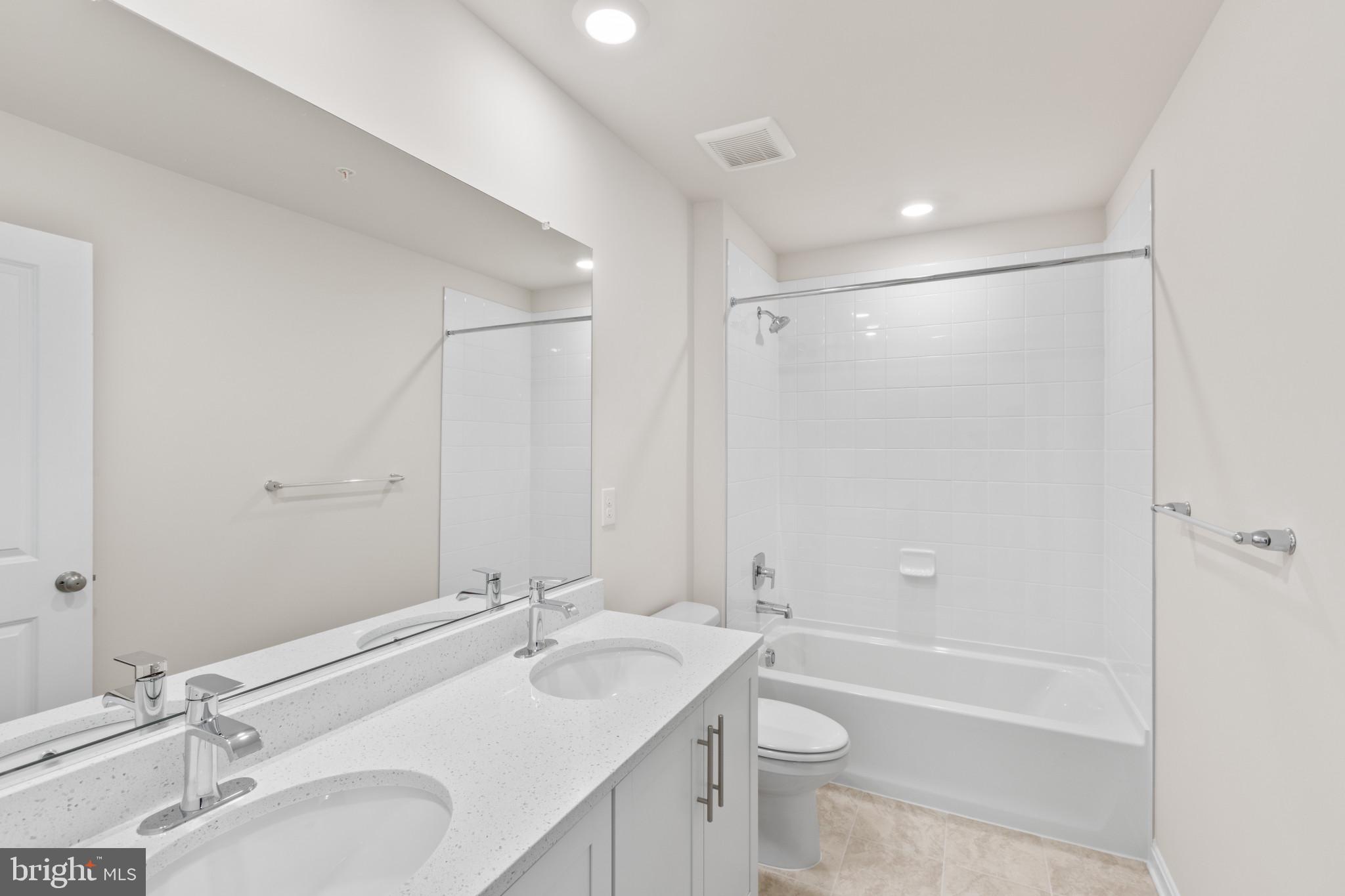 3704 Devonann Lane Edgewater, MD 21037 - Photo 18 of 32 a bathroom with a sink double vanity granite tub shower and a mirror