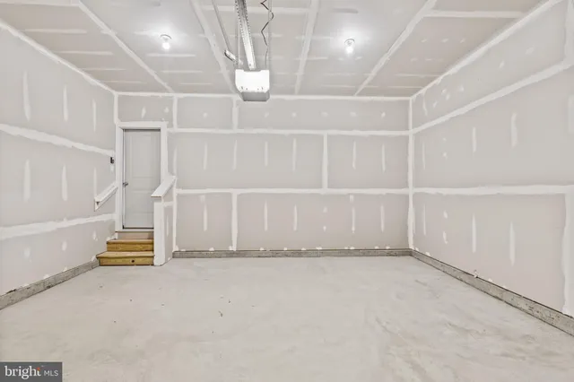 an empty room with staircase