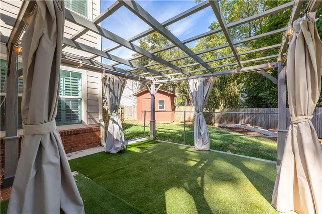 a backyard of a house with lots of green space