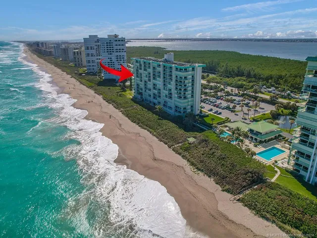 a view of a street with a building in the background